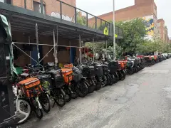 NYC block taken over by migrant workers for delivery bike parking as guard keeps overnight watch
