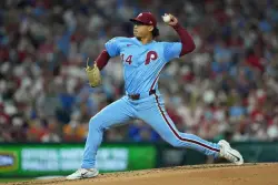 Luzardo retires 22 straight after rough start as Phillies sweep Mets and eye NL East title
